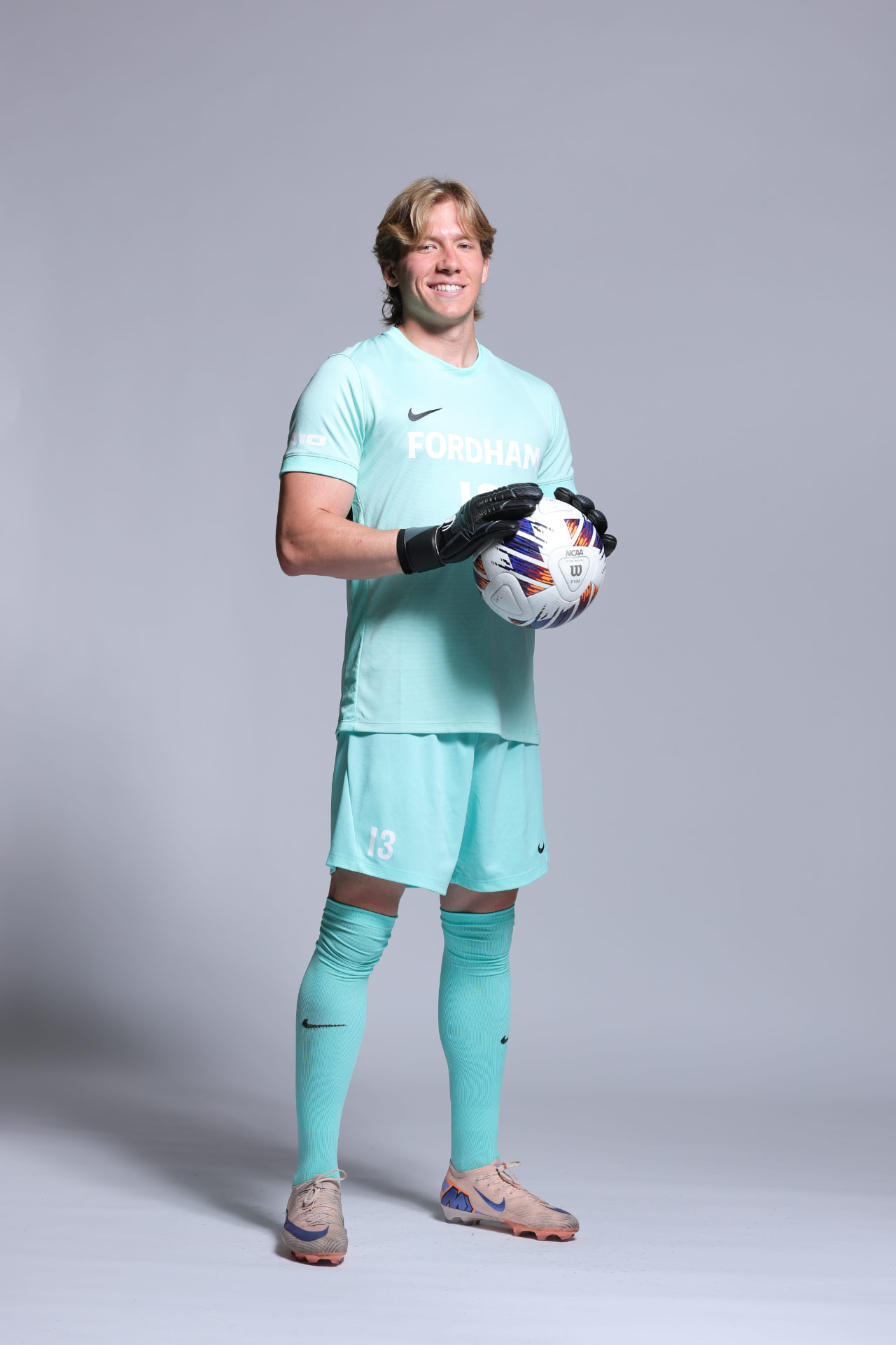 Edoardo Grandi in Fordham University Men's Soccer kit holding a ball